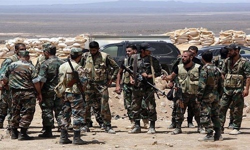 Quân đội Syria điều đặc nhiệm rời căn cứ quân sự tại Qamishli và triển khai tới tỉnh Deir Ezzur. Ảnh: FNA