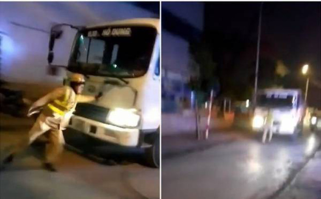 Tạm giữ hình sự tài xế xe tải đẩy CSGT chạy lùi trên phố
