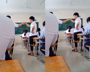 Làm việc riêng trong lớp, hai nam sinh đứng bắt tay cả tiết học