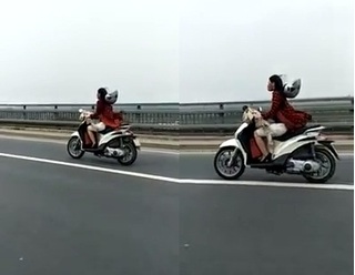 Clip: Cô gái phóng xe máy 'bạt mạng' đến tung cả mũ bảo hiểm