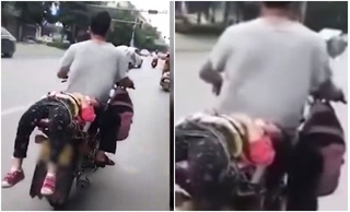 Lý do không tưởng vụ cháu bé giãy dụa gào khóc vì bị trói sau xe máy