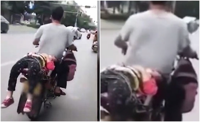 Giãy dụa không chịu đi học, bố trói luôn con gái vào xe chở đến trường