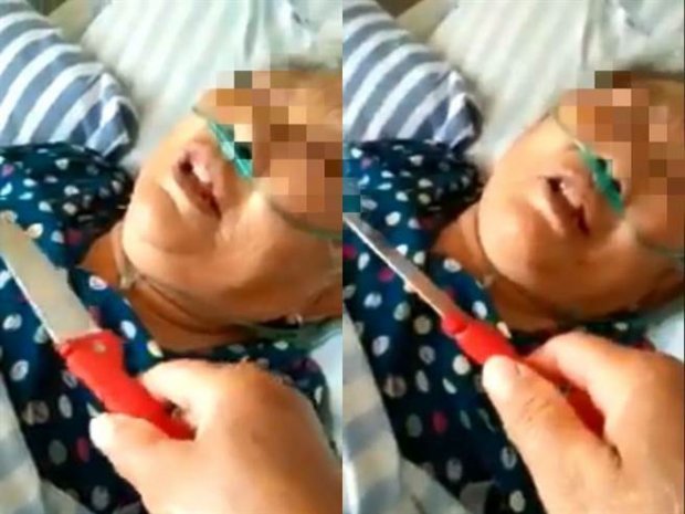 Mẹ già nằm viện, con gái không đoái hoài chăm sóc mà còn kề dao vào cổ