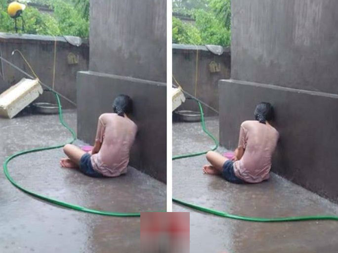 Bức ảnh cô gái dầm mưa ướt sũng, ngồi khóc vì thất tình