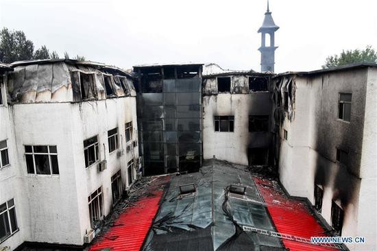 Hàng chục thi thể biến dạng trong vụ cháy khách sạn ở Trung Quốc