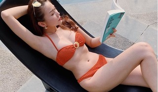 Thanh Hằng gây tranh cãi khi mặc bikini đọc sách bên bể bơi