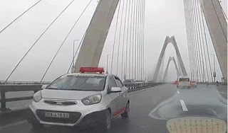 Bất ngờ với lý do tài xế taxi đi ngược chiều trên cầu Nhật Tân 